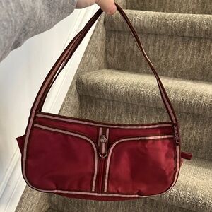 Mossimo small shoulder bag in a red/pink colour with striped detailing.